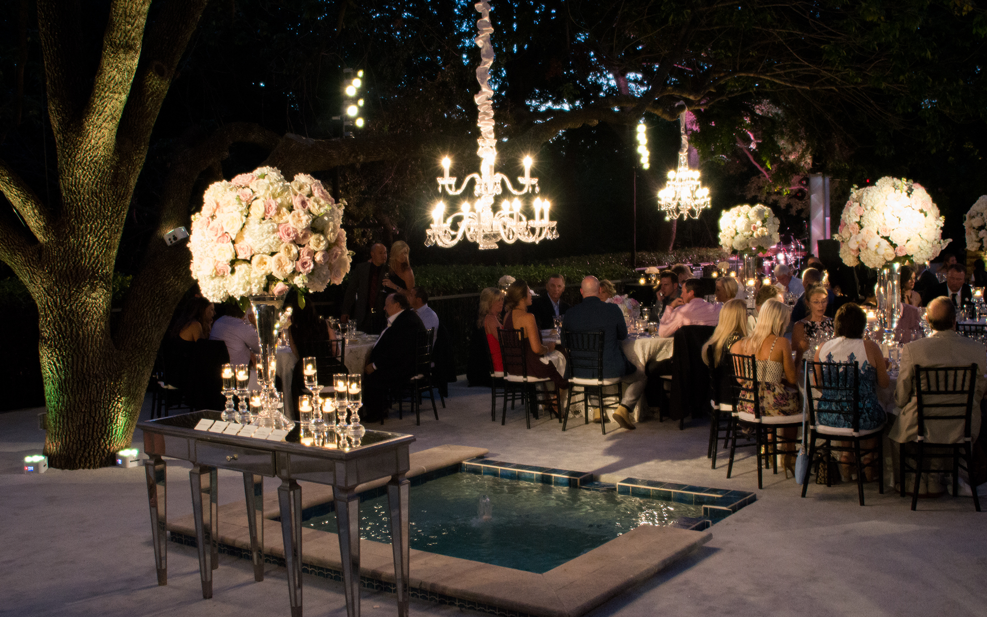 Chandeliers and decor lighting at outdoor wedding reception